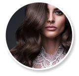 Woman with voluminous wavy brown hair